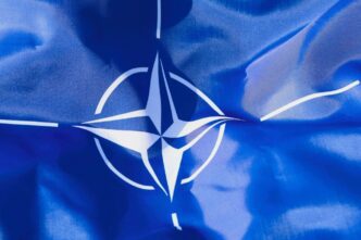 The blue and white flag of the North Atlantic Treaty Organization (NATO)