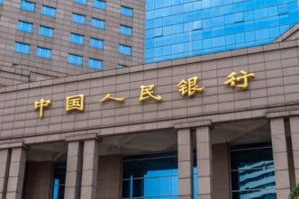 The People's Bank of China building with gold lettering and blue glass windows