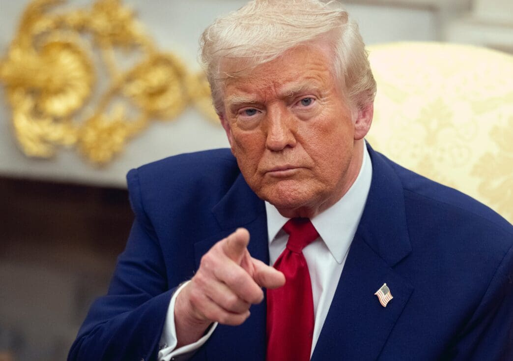 Donald Trump points forward while meeting with Benjamin Netanyahu