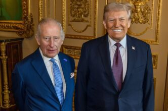 King Charles III and Donald Trump standing side-by-side and posing for a formal portrait