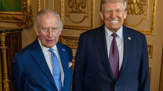 King Charles III and Donald Trump standing side-by-side and posing for a formal portrait