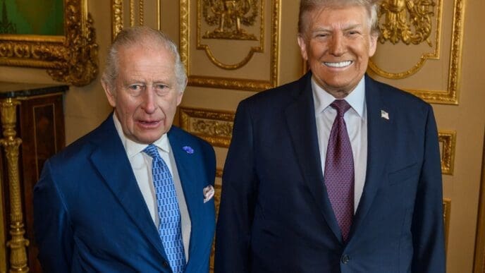 King Charles III and Donald Trump standing side-by-side and posing for a formal portrait