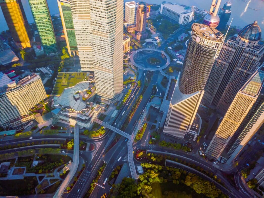 Aerial view of Pudong financial district in Shanghai with skyscrapers and roads
