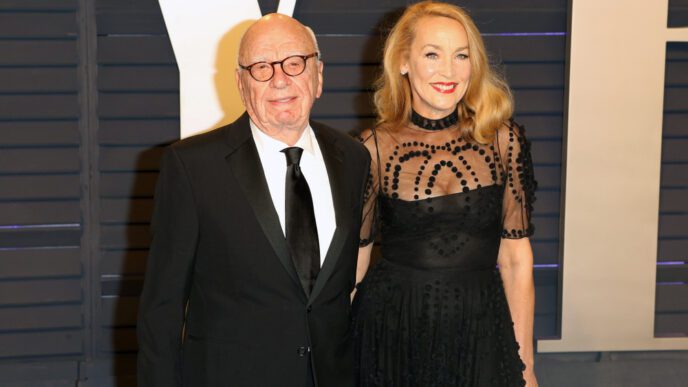 Rupert Murdoch and Jerry Hall pose together on the red carpet at a formal event