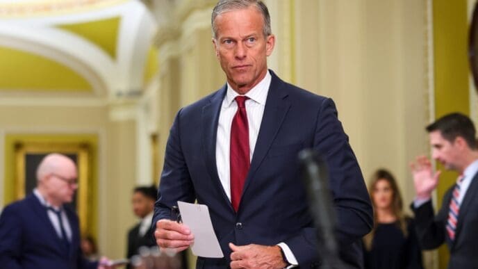 Senate Majority Leader John Thune holds a paper as he speaks to reporters in the US Capitol