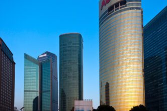 Modern skyscrapers and corporate buildings in Shanghai's Lujiazui financial district under a blue sky