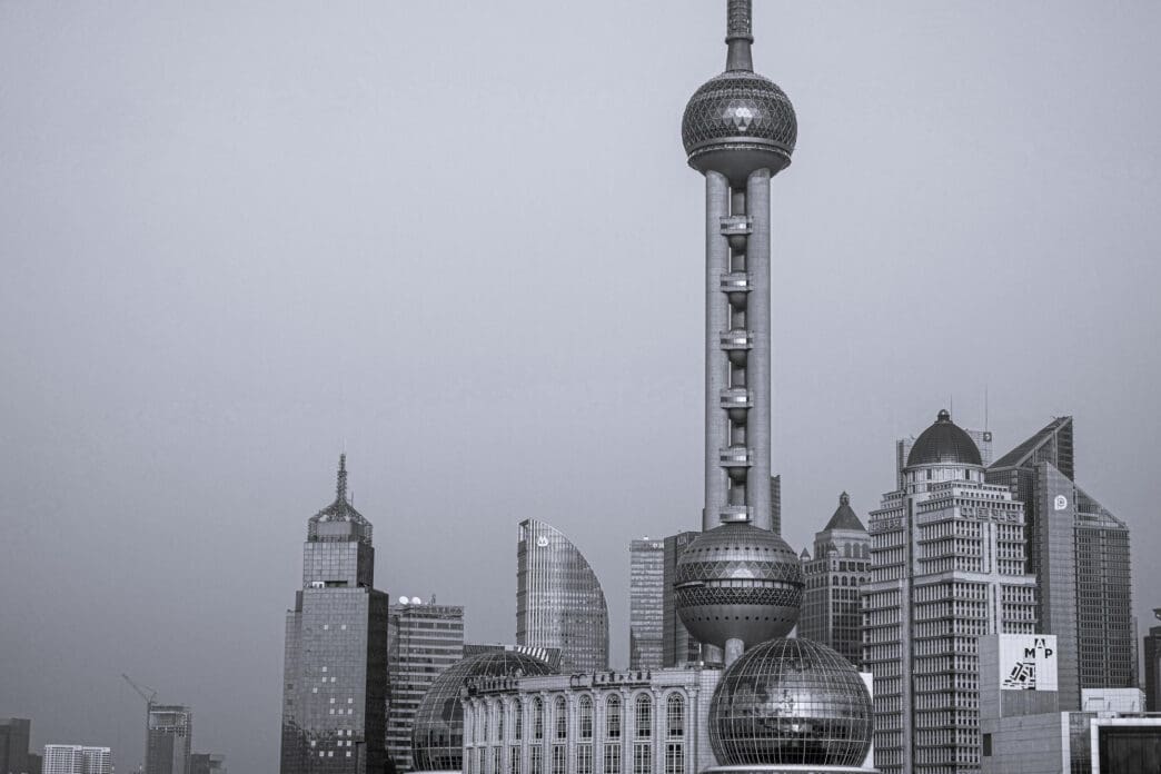 Black and white view of the Shanghai skyline with the Oriental Pearl Tower