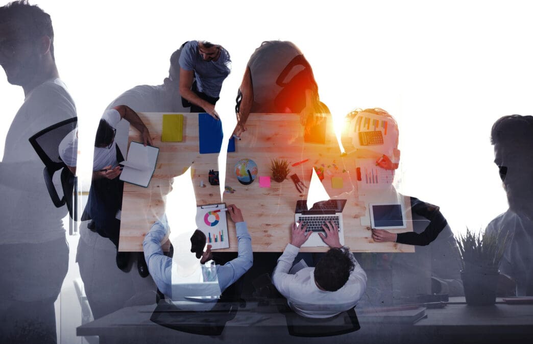 Double exposure of people working in a modern office and abstract shapes