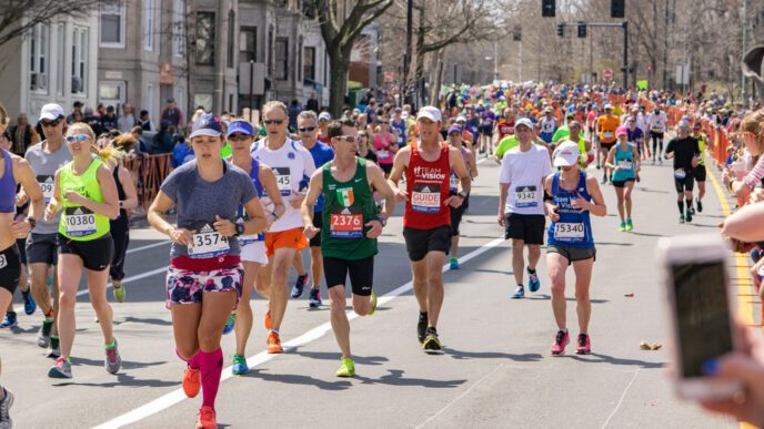 Runners of all ages and abilities participate in the Boston Marathon on a clear day