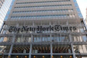 The New York Times building with its large, iconic logo on the facade