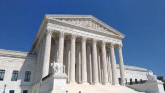 The United States Supreme Court building in Washington D.C., a large white marble structure with Corinthian columns