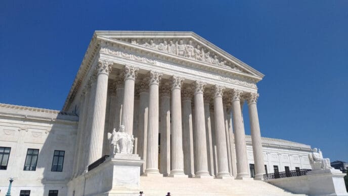 The United States Supreme Court building in Washington D.C., a large white marble structure with Corinthian columns