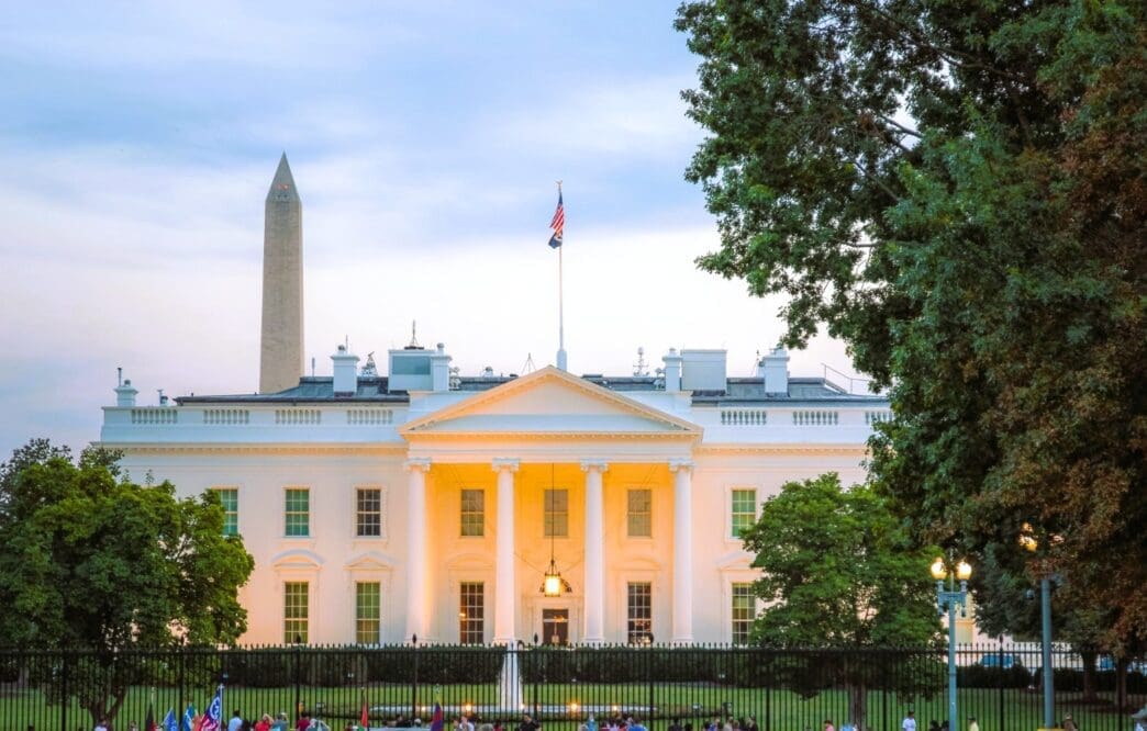 The White House and the Washington Monument are seen at dusk.