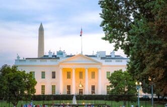 The White House and the Washington Monument are seen at dusk.