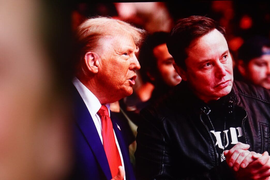 Donald Trump talks with Elon Musk at an event