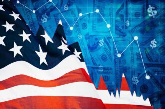 A composite image showing the American flag on the left and a stock market graph in decline over a background of US hundred-dollar bills on the right.