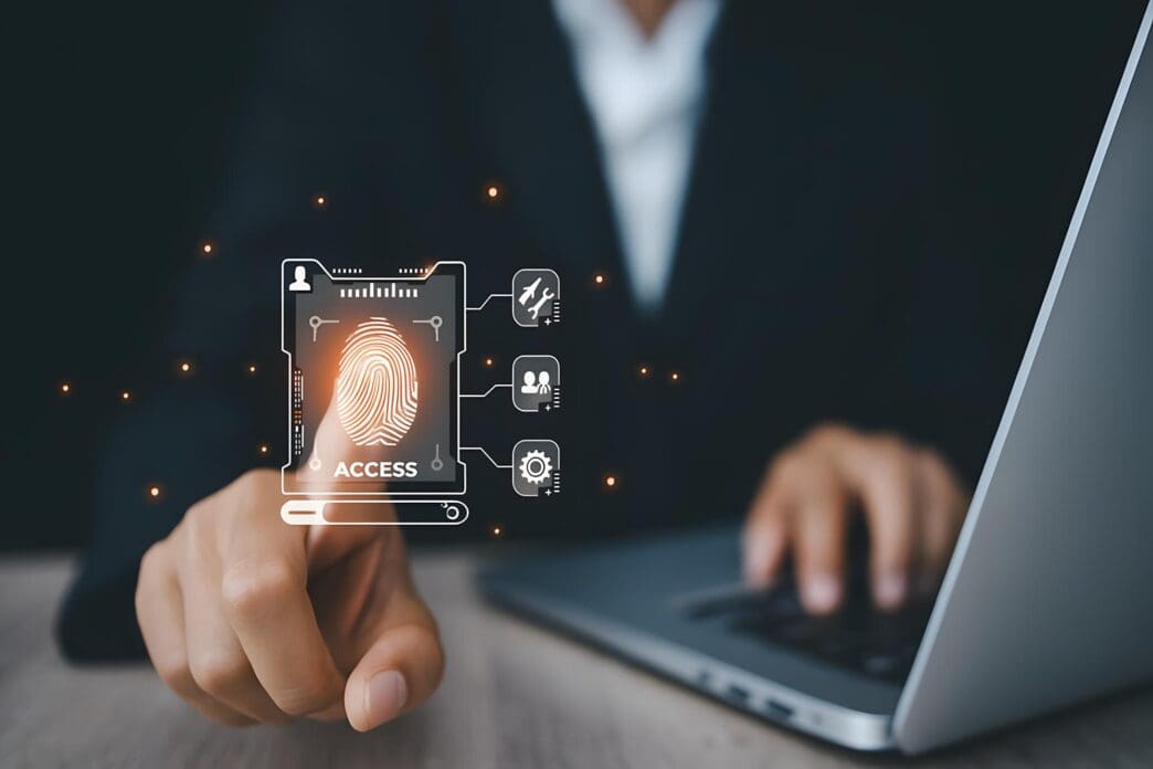 Close-up of a laptop screen displaying a fingerprint authentication prompt.