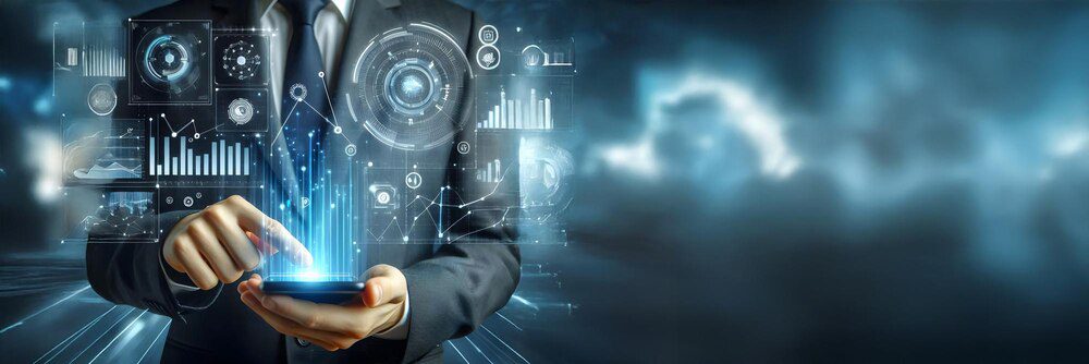 A businessman uses technology, likely a computer, for data analysis and communication.