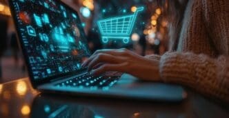 A person uses a laptop for online shopping in a brightly lit urban environment at night.