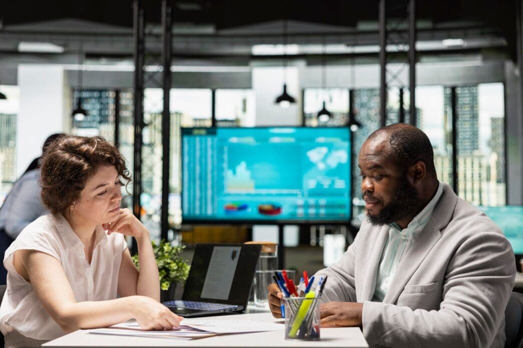 A human resources professional advises a job seeker during a career counseling session.