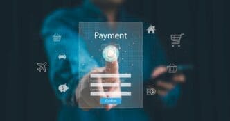 Man using a credit card to make a secure online payment on a website with a shield icon.