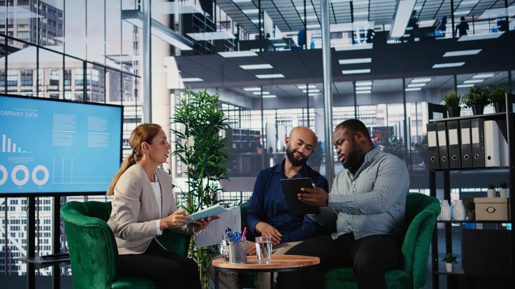 Diverse business leaders collaborating, exchanging ideas, and formulating a plan.