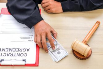 A person in a judge's robe places a stack of money on a desk, symbolizing a corrupt deal.