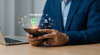 Person's hands holding a smartphone, likely making a secure online payment.