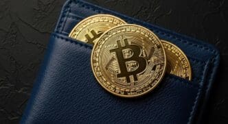 A sleek, modern digital wallet displays Bitcoin symbols, representing secure cryptocurrency storage.