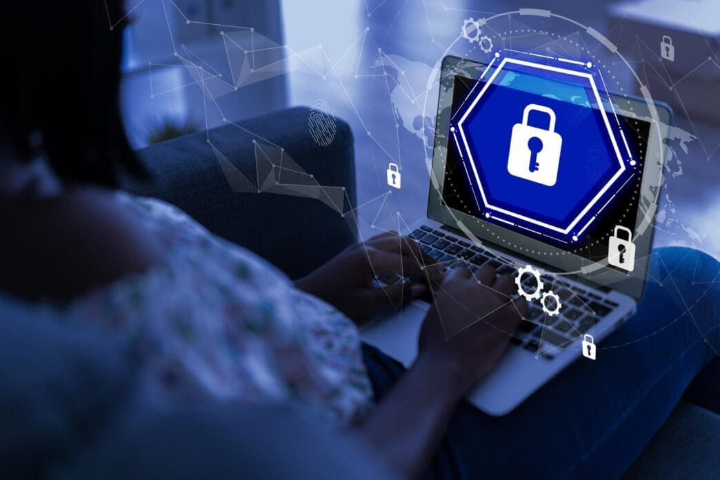 A laptop displays a secure login screen, illustrating cybersecurity in a contemporary office setting.