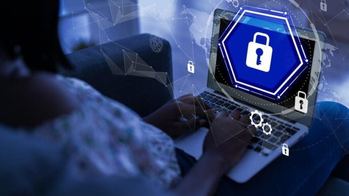 A laptop displays a secure login screen, illustrating cybersecurity in a contemporary office setting.