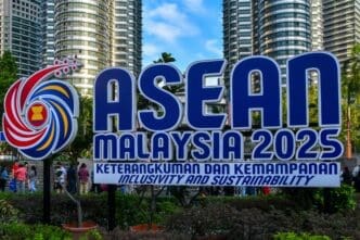 The large blue "ASEAN MALAYSIA 2025" sign with the Petronas Towers in the background.