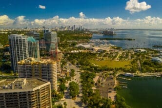 erial view of high-rise buildings, marinas, and parks along the waterfront of Coconut Grove, Miami.