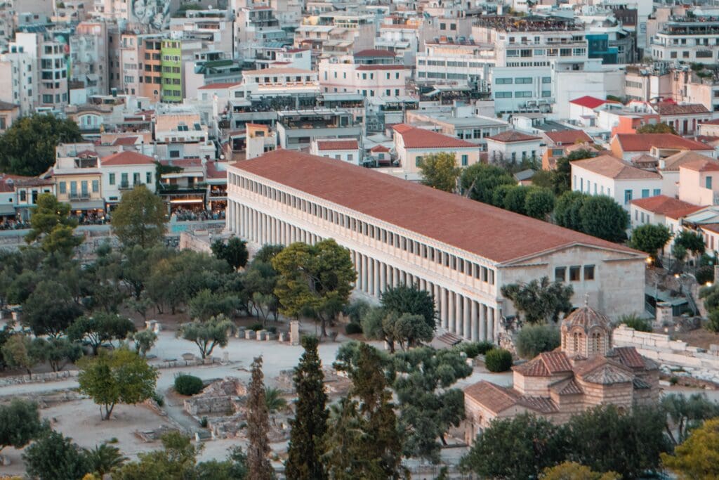 An aerial view of the long, reconstructed Stoa of Attalos with its colonnade, located in the Ancient Agora of Athens, Greece.