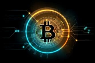 Glowing digital illustration of the Bitcoin symbol centered within a futuristic circuit board ring of blue and orange light.