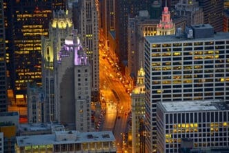 Cityscape at night with illuminated buildings and traffic