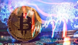 A close-up of a physical Bitcoin coin superimposed over a digital world map and stock market graph