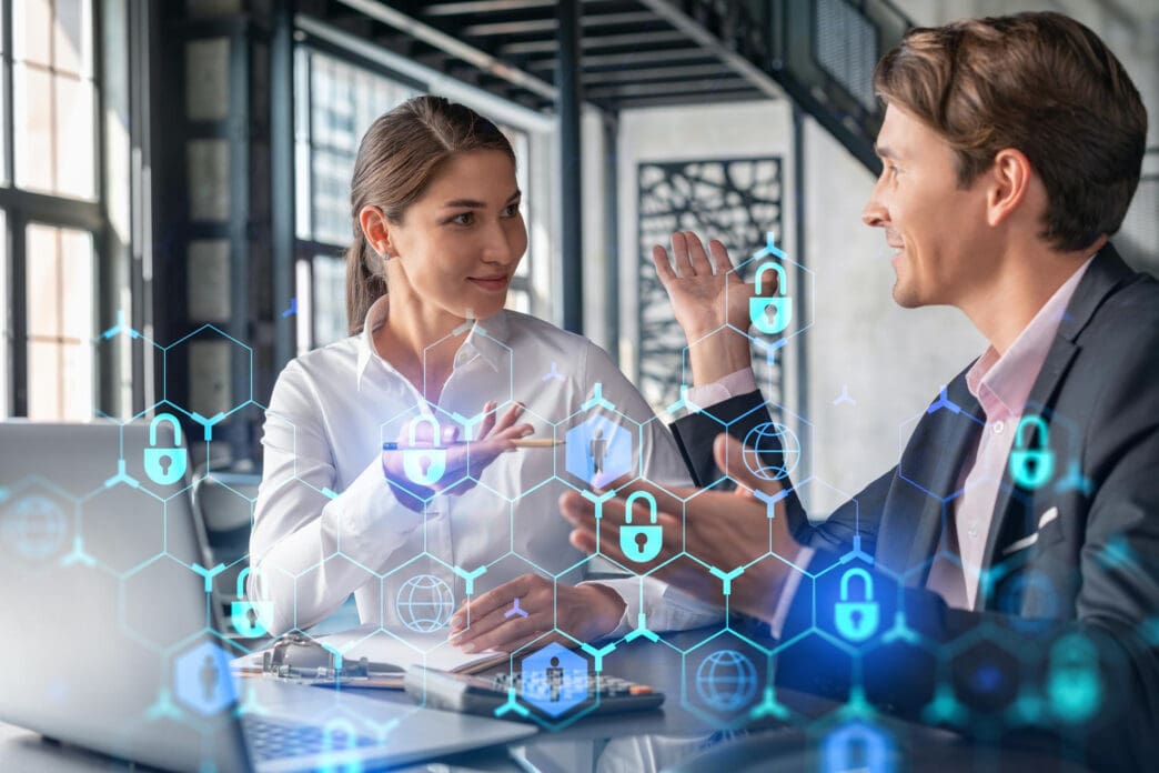 Two business professionals discussing with a digital security interface