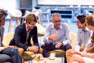 Diverse group of business professionals in a lively discussion