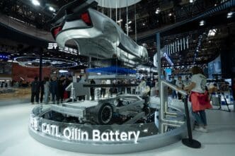 CATL Qilin Battery chassis and a partial car body displayed on a circular platform at the 2024 Beijing Auto Show.