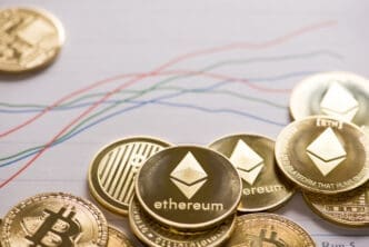 Physical Ethereum and Bitcoin coins scattered on top of a printed financial chart.