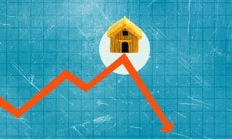 Conceptual collage showing a steep orange downward arrow under a small wooden house, set against a blue grid.