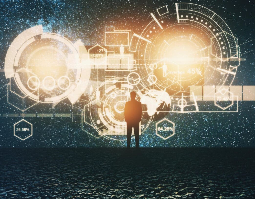 A silhouette of a person standing on a textured surface, facing a wall of glowing orange and white futuristic holographic data interfaces.