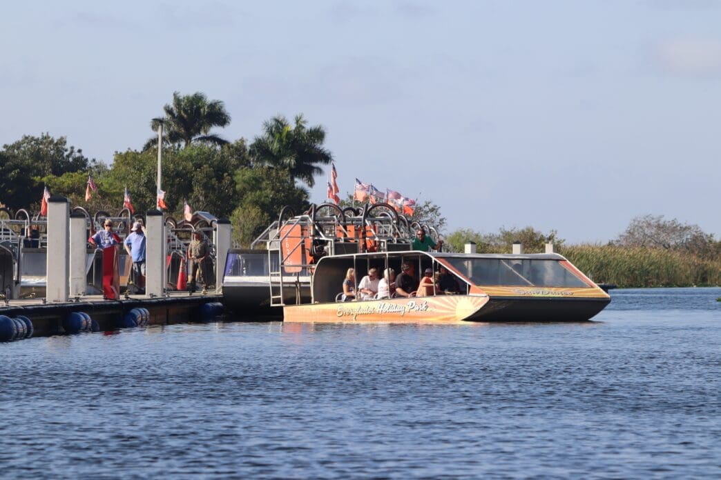 An Everglades Holiday Park airboat with tourists docked at Port Everglades, Florida.