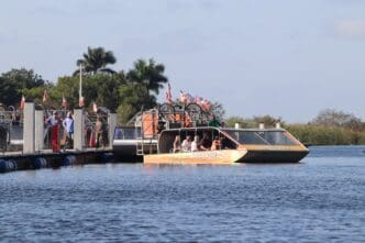 An Everglades Holiday Park airboat with tourists docked at Port Everglades, Florida.