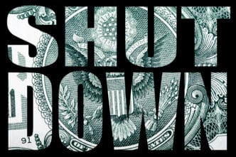 The words "SHUT DOWN" are shown with the US dollar bill's eagle design as a fill.