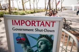 A sign in Battery Park, New York, announcing a government shutdown and Statue of Liberty closure.