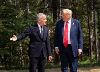 Canadian Prime Minister Mark Carney (L) speaks with US President Donald Trump at the G7 Summit in Canada.
