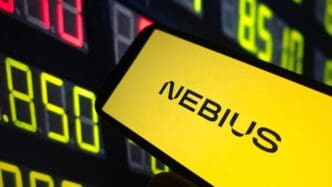 The Nebius Group logo is displayed on a smartphone, with a background of a colorful digital stock ticker display.