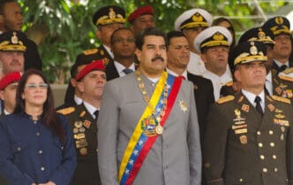Nicolás Maduro with Cilia Flores and Padrino López at a 2017 Caracas parade.